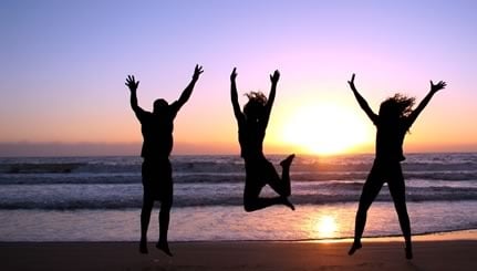 3_people_jumping_beach_sunset